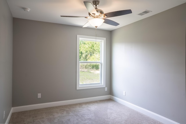 unfurnished room featuring carpet floors and ceiling fan