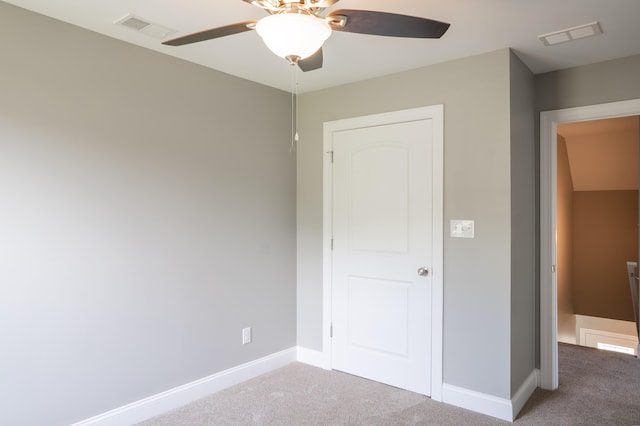 unfurnished bedroom featuring carpet and ceiling fan