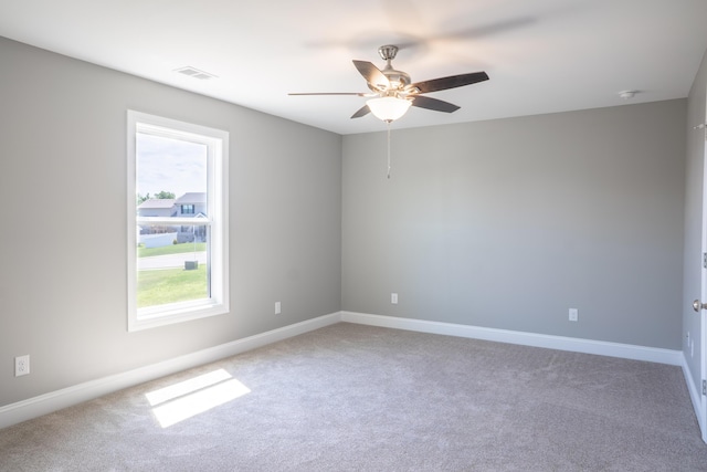 unfurnished room featuring carpet floors and ceiling fan