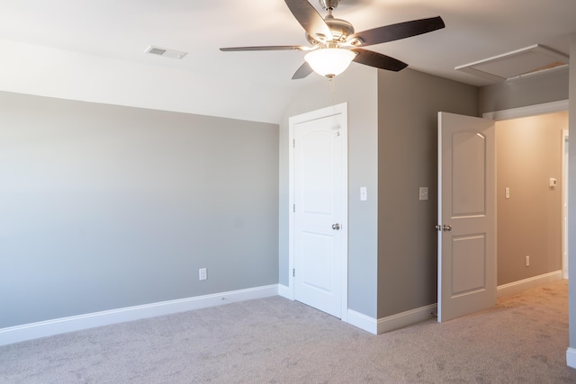 unfurnished bedroom with vaulted ceiling, light carpet, and ceiling fan