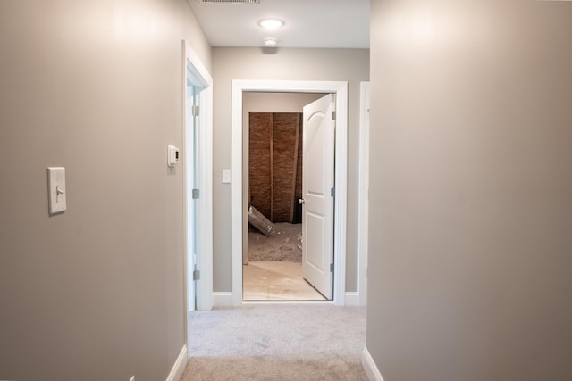 corridor with light carpet