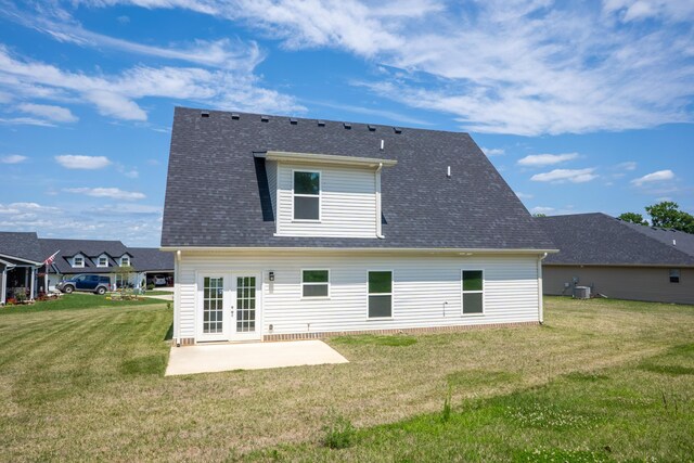 back of property featuring a patio, central AC, a lawn, and french doors