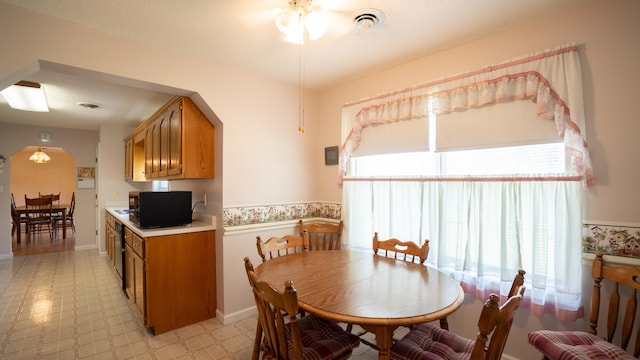 dining area with light tile patterned floors and plenty of natural light