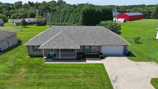 ranch-style house with a front yard and a garage