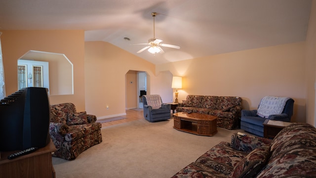 living room featuring ceiling fan, carpet, and lofted ceiling