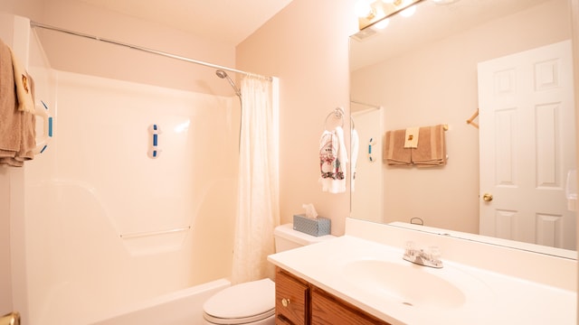 full bathroom with vanity, shower / bath combination with curtain, and toilet