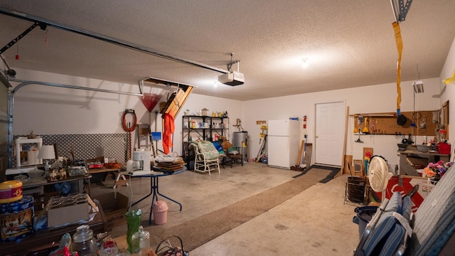 garage featuring a workshop area, a garage door opener, and white fridge