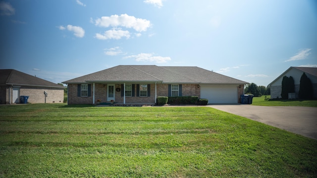 ranch-style home with a front yard and a garage