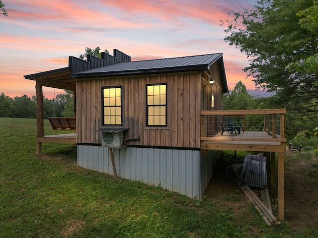 outdoor structure at dusk with a yard