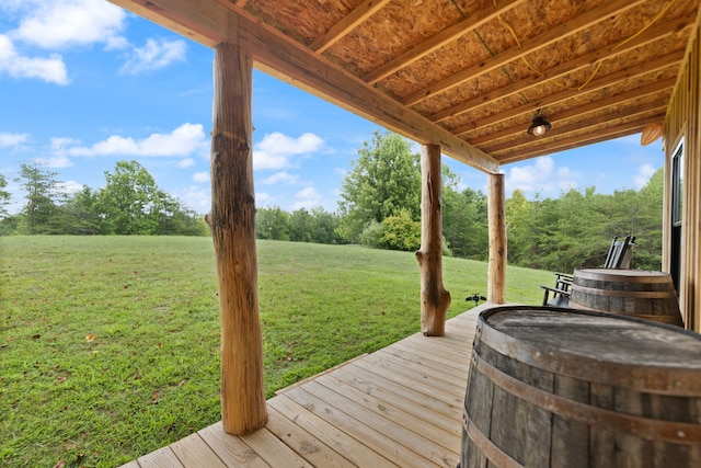 wooden terrace with a lawn