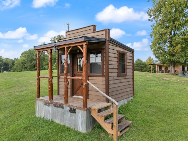 view of outdoor structure with a lawn