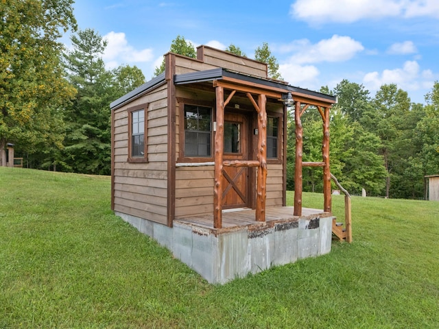 view of outbuilding with a yard