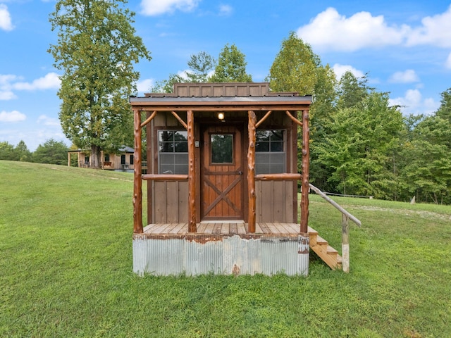 view of outbuilding with a yard