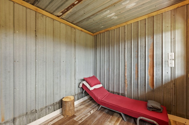 living area with wood-type flooring and wood ceiling