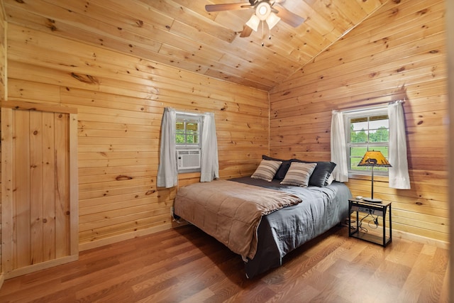 bedroom with wooden ceiling, vaulted ceiling, hardwood / wood-style flooring, and multiple windows