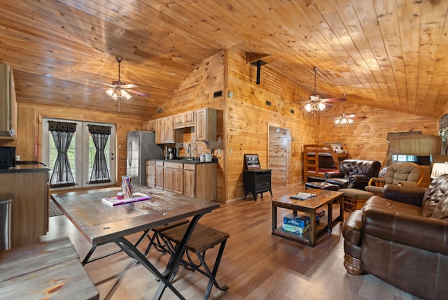 living room with wood ceiling, high vaulted ceiling, ceiling fan, and wood-type flooring