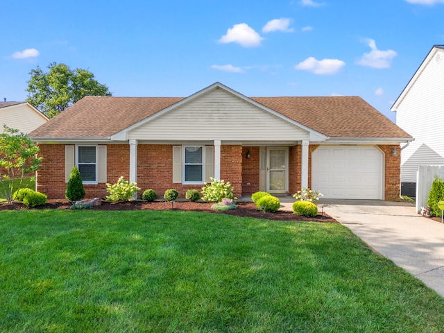 single story home featuring a garage and a front yard