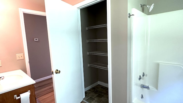 bathroom featuring vanity and tub / shower combination