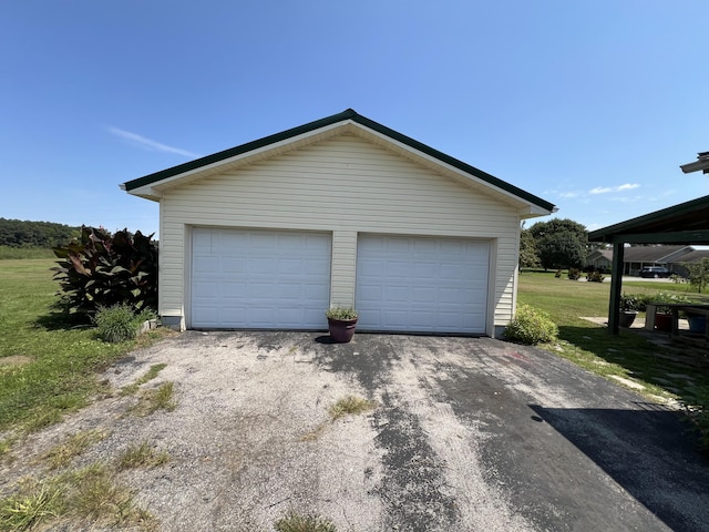 garage featuring a yard