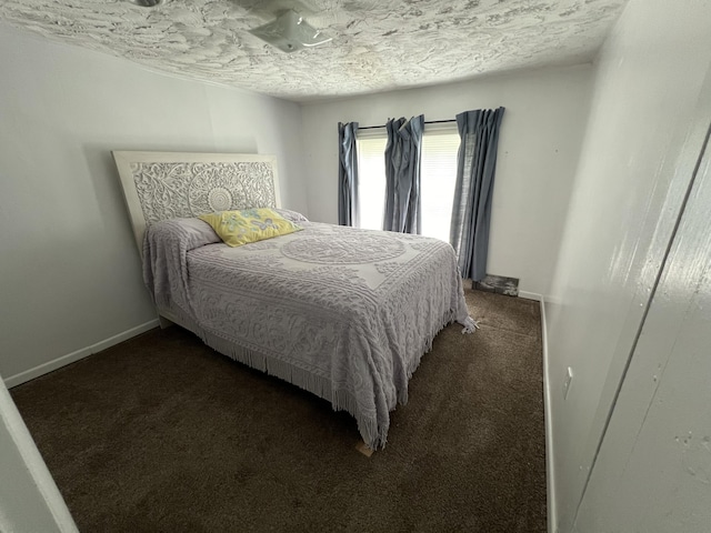 carpeted bedroom with a textured ceiling