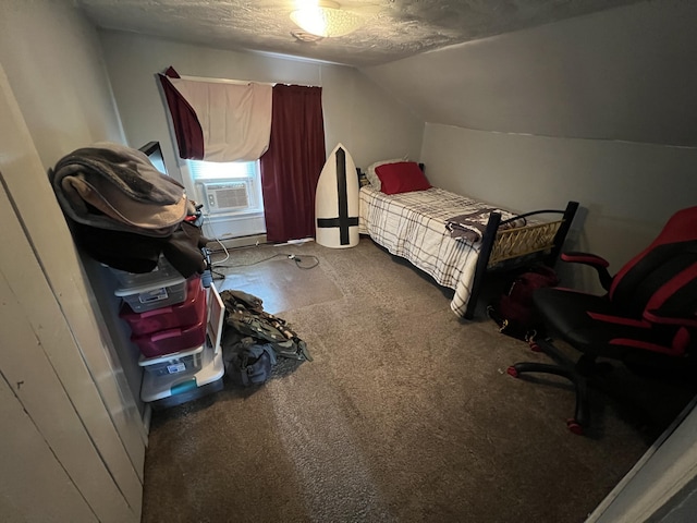 carpeted bedroom featuring a textured ceiling and vaulted ceiling