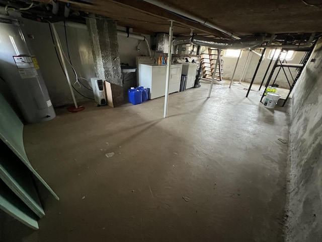 basement with washer and dryer and water heater