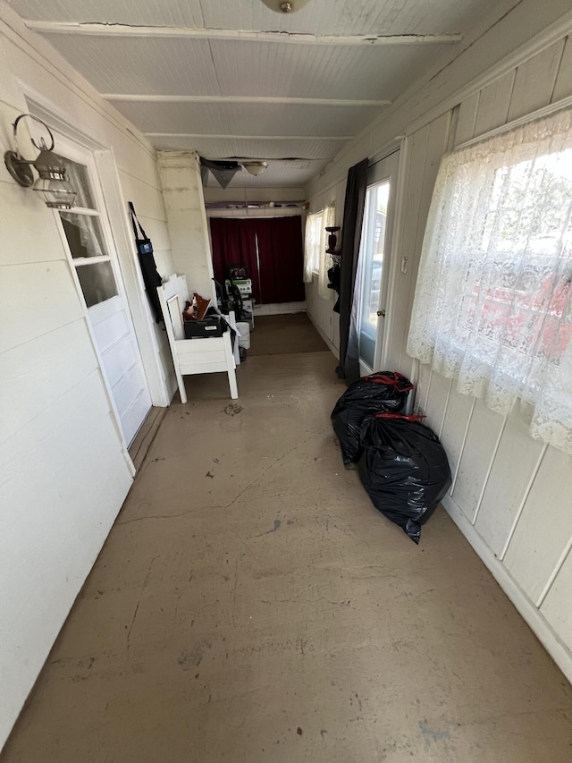 hallway featuring concrete flooring