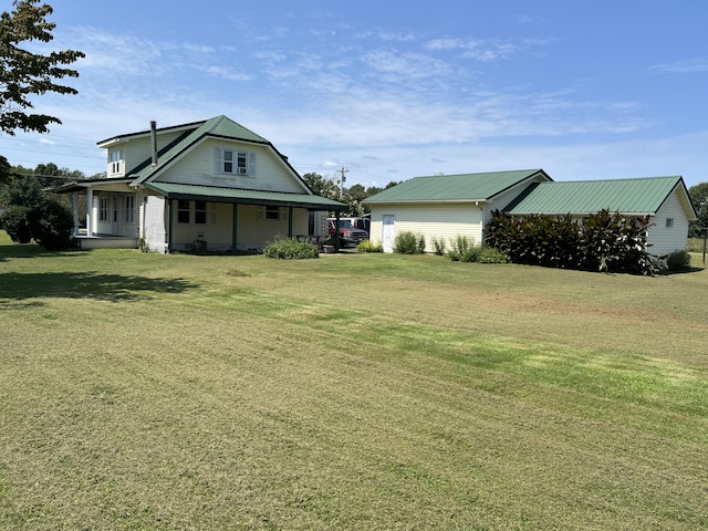 view of yard featuring covered porch