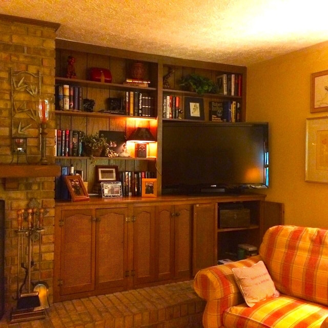 interior space featuring a textured ceiling and a fireplace