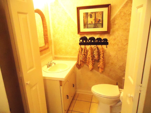 bathroom featuring tile patterned flooring, vanity, and toilet