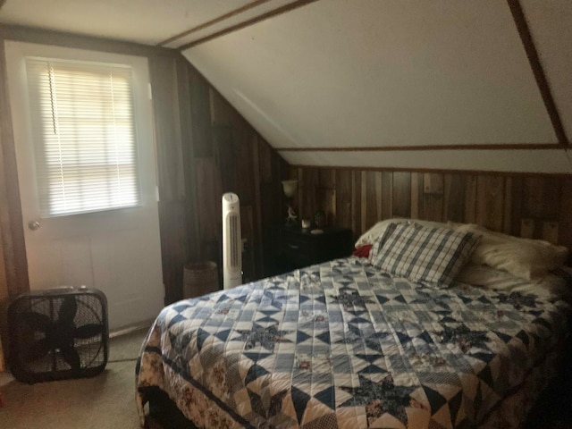 carpeted bedroom featuring lofted ceiling