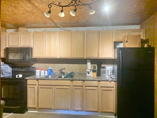 kitchen featuring light brown cabinets, sink, and black appliances