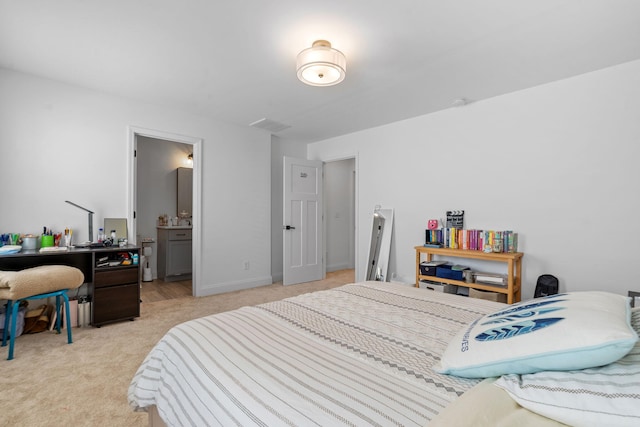 bedroom featuring light colored carpet and baseboards