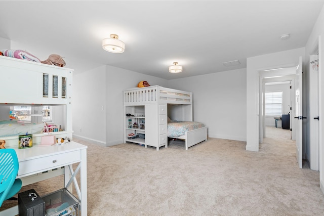 bedroom featuring carpet flooring and baseboards