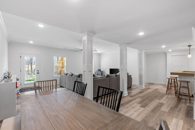 dining room featuring light wood finished floors, recessed lighting, ornate columns, ceiling fan, and baseboards