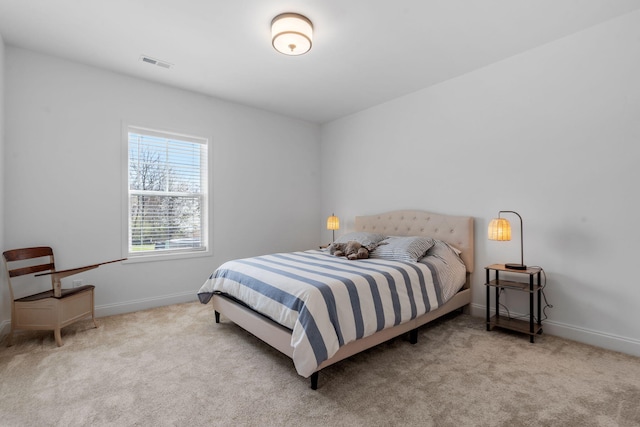 bedroom featuring carpet, visible vents, and baseboards