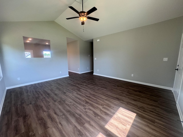 empty room with lofted ceiling, dark wood-type flooring, and ceiling fan