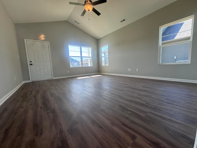 unfurnished room with ceiling fan, vaulted ceiling, and dark hardwood / wood-style flooring