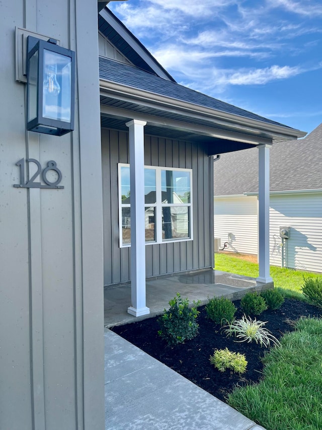 view of exterior entry with a patio