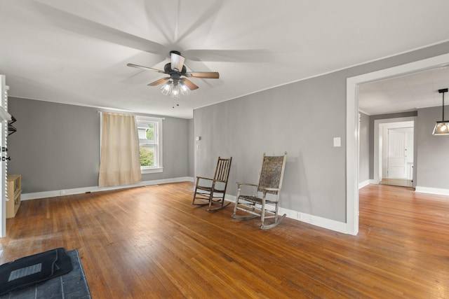 unfurnished room featuring ceiling fan and hardwood / wood-style floors