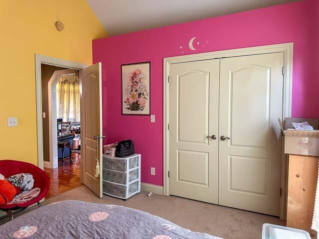 carpeted bedroom with a closet