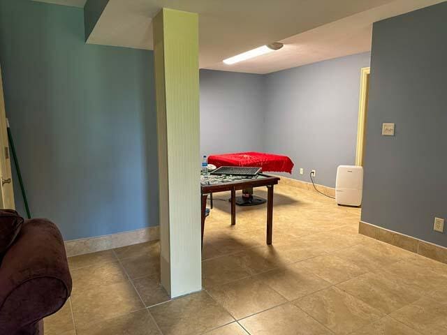 rec room with tile patterned flooring