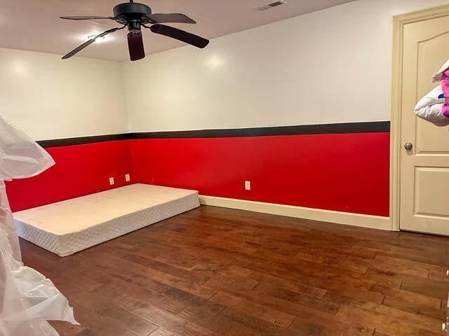 interior space with ceiling fan and wood-type flooring