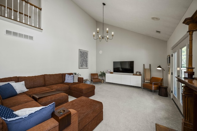 living room featuring carpet floors, a chandelier, visible vents, and high vaulted ceiling