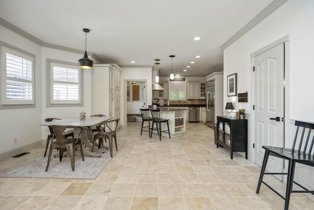 dining space featuring crown molding, recessed lighting, visible vents, and a healthy amount of sunlight