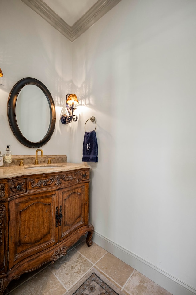 bathroom with ornamental molding, tile patterned floors, and vanity