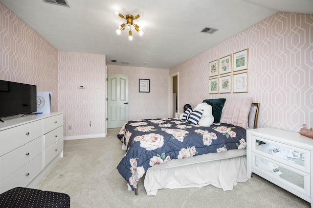 bedroom with visible vents, light carpet, baseboards, and wallpapered walls