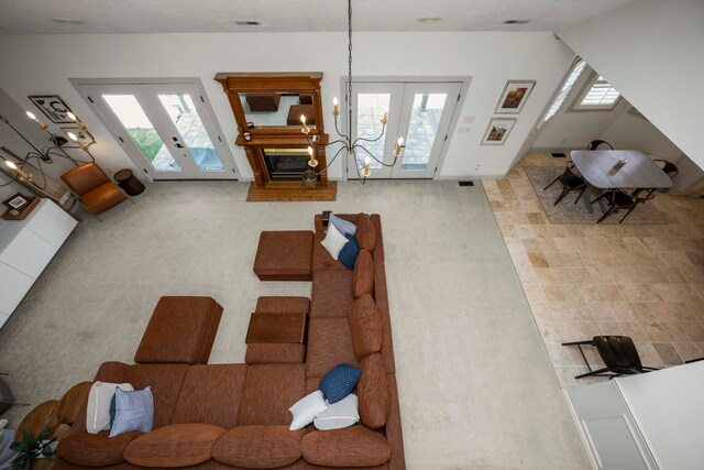 carpeted living room with french doors