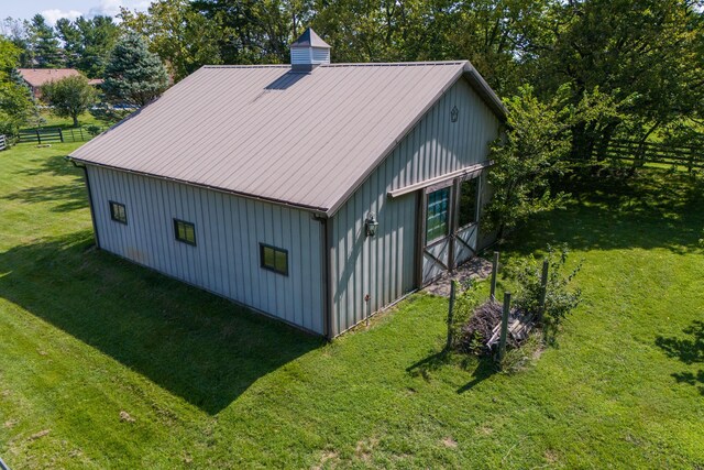 view of side of property with a lawn