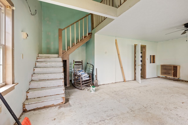 stairs with ceiling fan